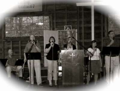 Rebecca Hammer (center) joins the family song leaders