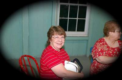 Nancy Borden, left,  relaxes in the dining hall