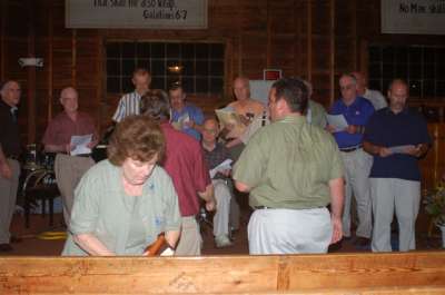 Christopher Adams organizes the men's choir